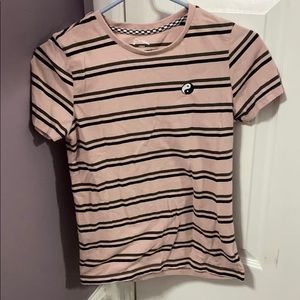 pink tee w/ black stripes on it w/ a yin yang